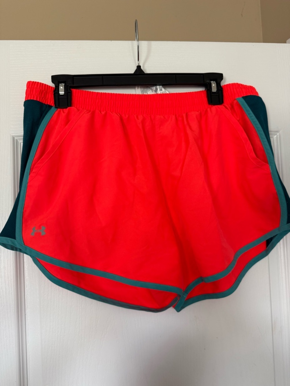 Under Armour Women’s Coral Pink Athletic Shorts with Teal Trim